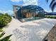 A spacious backyard featuring a screened-in pool area with ample space for outdoor lounging and entertainment at 315 Wildflower Rd, Davenport, FL 33837
