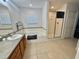 Bright bathroom with a shower, bathtub, vanity and tile flooring at 315 Wildflower Rd, Davenport, FL 33837