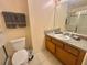 Functional bathroom with a vanity, mirror, and a combined shower and tub for convenience at 315 Wildflower Rd, Davenport, FL 33837