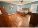 Stylish bedroom with wood floors, a ceiling fan, and plenty of space for a comfortable retreat at 315 Wildflower Rd, Davenport, FL 33837