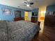 Spacious bedroom with a ceiling fan, hard wood floors, and en suite access at 315 Wildflower Rd, Davenport, FL 33837