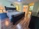 Comfortable bedroom with wood flooring, a ceiling fan, and ample space, ideal for rest and relaxation at 315 Wildflower Rd, Davenport, FL 33837