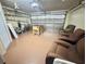 Garage with a foosball table and seating area at 315 Wildflower Rd, Davenport, FL 33837