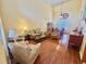 Bright and airy living room with vaulted ceilings and hardwood flooring at 315 Wildflower Rd, Davenport, FL 33837