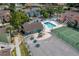 Aerial view showcases the pool, playground, and tennis court area of the condominium complex at 3151 Britannia Blvd # C, Kissimmee, FL 34747