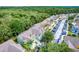Aerial shot of condos, parking, and landscaping backing up to green space at 3151 Britannia Blvd # C, Kissimmee, FL 34747