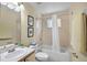 Well-lit bathroom with shower-tub combo, toilet, and vanity sink at 3151 Britannia Blvd # C, Kissimmee, FL 34747