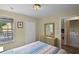 Bedroom featuring a window, closet, dresser, and laundry area access at 3151 Britannia Blvd # C, Kissimmee, FL 34747