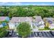 Exterior view of multi-story condominium with staircase, parking, and landscaping at 3151 Britannia Blvd # C, Kissimmee, FL 34747