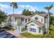 Attractive condo building with lush green landscaping, offering a welcoming exterior and ample parking for residents at 3151 Britannia Blvd # C, Kissimmee, FL 34747