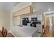 Bright kitchen with stainless steel sink, black appliances, white cabinets, and a connecting dining area at 3151 Britannia Blvd # C, Kissimmee, FL 34747