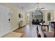 Bright living room with a large window, ceiling fan, and wood floors, creating a comfortable and stylish space at 3151 Britannia Blvd # C, Kissimmee, FL 34747