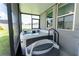 Screened-in patio features a relaxing hot tub with stairs, screened walls, and sun-filled windows at 3442 Monaco Ln, Davenport, FL 33897