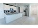 Beautiful kitchen with white cabinets, stainless steel appliances, granite countertops and center island at 3442 Monaco Ln, Davenport, FL 33897