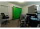 Bright office space with a green screen setup, an ergonomic chair, and modern computer equipment at 3442 Monaco Ln, Davenport, FL 33897