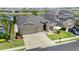 Charming home with lake view, lush lawn, patio seating and two-car garage in a desirable neighborhood at 3698 Cortland Dr, Davenport, FL 33837
