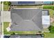 An aerial view showcases the property's roof, screened-in patio, and outdoor fire pit at 3698 Cortland Dr, Davenport, FL 33837