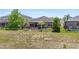 The property features a spacious backyard with a screened-in patio and fire pit at 3698 Cortland Dr, Davenport, FL 33837