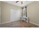 Bedroom with a closet, a carpeted floor, and a white digital piano next to a window at 3698 Cortland Dr, Davenport, FL 33837