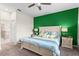 Bright bedroom featuring colorful bedding, decorative lamps, and a ceiling fan at 3698 Cortland Dr, Davenport, FL 33837