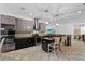 Open kitchen with stainless steel appliances, granite countertops, a large island and pendant lighting at 3698 Cortland Dr, Davenport, FL 33837
