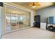 Spacious lanai with tile flooring, ceiling fan, and a view of the interior, ideal for relaxing and entertaining at 3698 Cortland Dr, Davenport, FL 33837