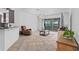 Bright living room with tile flooring, a recliner, view through sliding glass door to the lanai at 3698 Cortland Dr, Davenport, FL 33837
