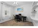 Well-lit home office with shelves, a neutral color palette, and a cozy carpet at 3698 Cortland Dr, Davenport, FL 33837