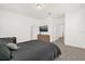 Bedroom featuring a plush bed, a stylish dresser, and a mounted tv at 4736 Homestead Trl, St Cloud, FL 34772