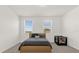 Bedroom features a plush bed, a bright window, and a crib at 4736 Homestead Trl, St Cloud, FL 34772