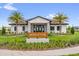 Beautiful Meadow Club building with stone accents, a welcoming entrance, and lush landscaping at 4736 Homestead Trl, St Cloud, FL 34772