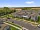 Aerial view of a modern residential community showcasing gray homes and well-maintained streets at 4736 Homestead Trl, St Cloud, FL 34772
