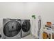 Convenient laundry room featuring new washer and dryer units at 4736 Homestead Trl, St Cloud, FL 34772