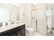A well-lit bathroom features a modern sink, a walk-in shower and vanity at 4903 Windermere Ave, Kissimmee, FL 34746