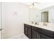 A bright bathroom featuring double sinks, modern vanity, and great lighting at 4903 Windermere Ave, Kissimmee, FL 34746