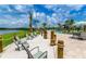Inviting beach area with comfortable lounge chairs, lake views, and access to community pool at 4903 Windermere Ave, Kissimmee, FL 34746