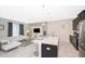 An open living area features modern decor, white tile floors and recessed lighting at 4903 Windermere Ave, Kissimmee, FL 34746