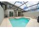 Beautiful backyard pool area with a screen enclosure and safety fence offers outdoor enjoyment at 4903 Windermere Ave, Kissimmee, FL 34746