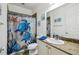 Charming bathroom featuring a vanity with a granite countertop and decorative shower curtain at 582 San Joaquin Rd, Poinciana, FL 34759