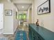 Inviting foyer featuring tile flooring, stylish decor, and views into the bright and airy living spaces at 582 San Joaquin Rd, Poinciana, FL 34759