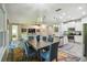 This open concept living space has a dining area and modern kitchen, perfect for entertaining and Gathering gatherings at 582 San Joaquin Rd, Poinciana, FL 34759