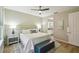 Spacious main bedroom with a king-size bed, hardwood flooring, and ensuite bathroom access at 582 San Joaquin Rd, Poinciana, FL 34759