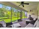 Spacious screened patio with comfortable seating and view of the backyard at 582 San Joaquin Rd, Poinciana, FL 34759