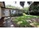 Backyard showcasing lawn, mature trees and the exterior of the home at 860 Oak Shore Dr, St Cloud, FL 34771