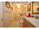 Bright bathroom featuring walk-in shower, tiled floor, and wooden vanity at 860 Oak Shore Dr, St Cloud, FL 34771