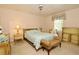 Comfortable bedroom with carpet, a large window, and classic furnishings at 860 Oak Shore Dr, St Cloud, FL 34771