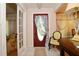 Open entryway with tile flooring, decorated door, and traditional furnishings at 860 Oak Shore Dr, St Cloud, FL 34771