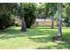 Home with well-manicured lawn and mature landscaping at 860 Oak Shore Dr, St Cloud, FL 34771