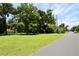 Property featuring a large lot with mature trees and well-kept grass at 860 Oak Shore Dr, St Cloud, FL 34771