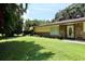 A beautiful lawn and stone accents highlight this home's curb appeal at 860 Oak Shore Dr, St Cloud, FL 34771
